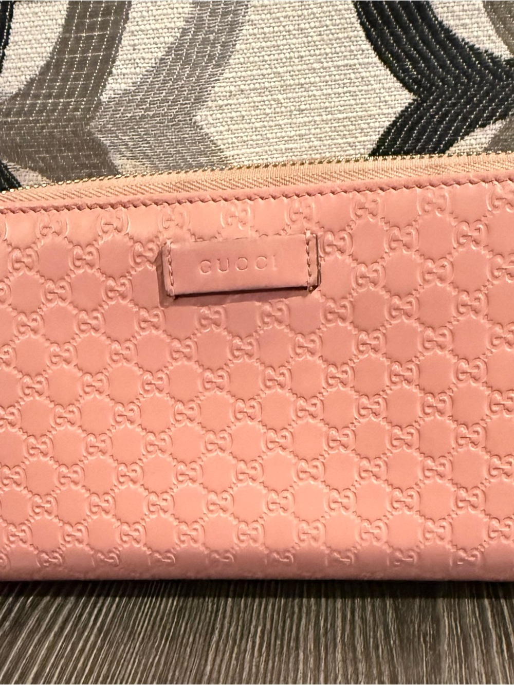 Gucci Pink Embossed microguccisima zippy wallet.